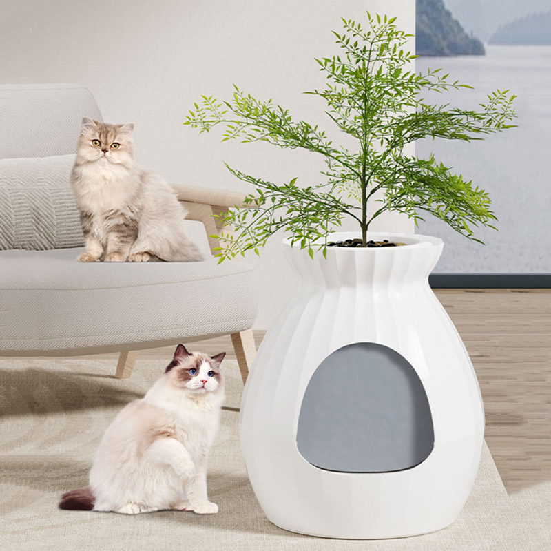 Caja de arena para gatos oculta con plantas artificiales